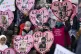Supporters of the Palestinians hold photographs of Palestini