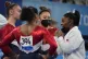 Simone Biles, of the United States, talks to teammates Jorda