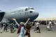 Fleeing Afghans alongside a US troop carrier that took off w