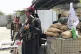 Taliban fighters stand guard at a checkpoint near the US emb