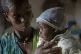 Ababa, 25, comforts her baby Wegahta, 6 months, who was iden