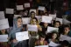 Women and teachers demonstrate inside a private school to de