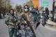 Taliban fighters stand guard during women's protest in Kabul