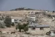 The Israeli settlement of Ma'on, in the background and overl