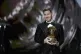 Lionel Messi reacts after winning the 2021 Ballon d'Or troph
