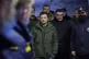 Ukrainian President Volodymyr Zelenskyy (centre) attends the