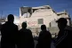 People look at the home of the Palestinian prisoner Mahmoud 