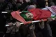 Palestinian mourners carry the body of 14-year-old Mohammed 