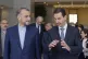 Syrian President Bashar Assad, right, speaks with Iran's For