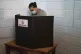 A man casts his vote during a referendum on whether to remov