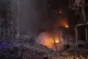 Firefighters try to put out a fire following an explosion in