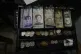 A cash register drawer holds Bolivars and US currencies at a