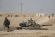 Turkish tanks and troops are deployed near the Syrian town o