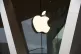 Apple logo adorns the facade of a retail store.