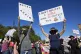 Protesters hold signs in Portland, Ore., about the Supreme C