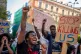 People shout slogans during a protest over the deaths of at 