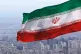 Iran’s flag flying over its capital city, Tehran