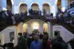 Protesters look around at the president's official residence