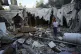 Rami Arada, inspects the rubble of his family house after it