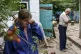 Nina Bilyk (left) wipes away tears Saturday, August 13, 2022