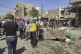 Syrian White Helmet civil defence workers (centre) gather wi