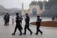 Uighur security personnel patrol near the Id Kah Mosque in K