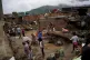 Local residents clean up homes damaged by floods in Las Teje