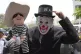 An anti-government demonstrator holds a doll in the likeness