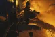Ukrainian State Emergency Service firefighters work to extin