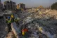 Members of a search and rescue operation work on an area tha
