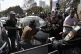 Police scuffle with Israelis blocking a main road to protest