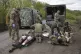 Military medics give first aid to wounded soldiers on the ro