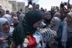 Palestinian Marwa al-Tamimi, 32 carries the body of her 2-ye