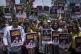 Supporters of opposition Congress party hold placards during