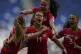 Costa Rica's Raquel Rodriguez (centre) is congratulated by h