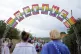 Festival goers walk under the 'Revive' sign during the Glast