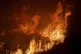 Flames consume brush along Gilman Springs Road during the Ra