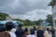 A group of tourists stand near a border station at Panmunjom