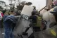 Anti-government protesters clash with police in downtown Lim