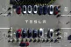 Tesla vehicles line a parking lot at the company's Fremont, 