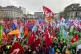 Protestors hold flags and gather during a demonstration agai