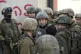 Israeli Prime Minister Benjamin Netanyahu, center, wears a p