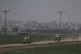 Israeli soldiers move near the Israeli-Gaza border as seen f