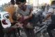 An injured Palestinian boy is carried from the ground follow