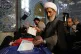 A cleric casts his ballot during the parliamentary and Assem