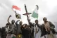 Houthi supporters attend a rally against the US air strikes 