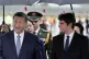 Chinese President Xi Jinping is welcomed by French Prime Min