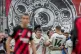 Leverkusen players celebrate their side's third goal during 