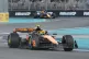 McLaren driver Lando Norris, of Britain, foreground, steers 