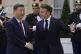 French President Emmanuel Macron (right) welcomes China's Pr